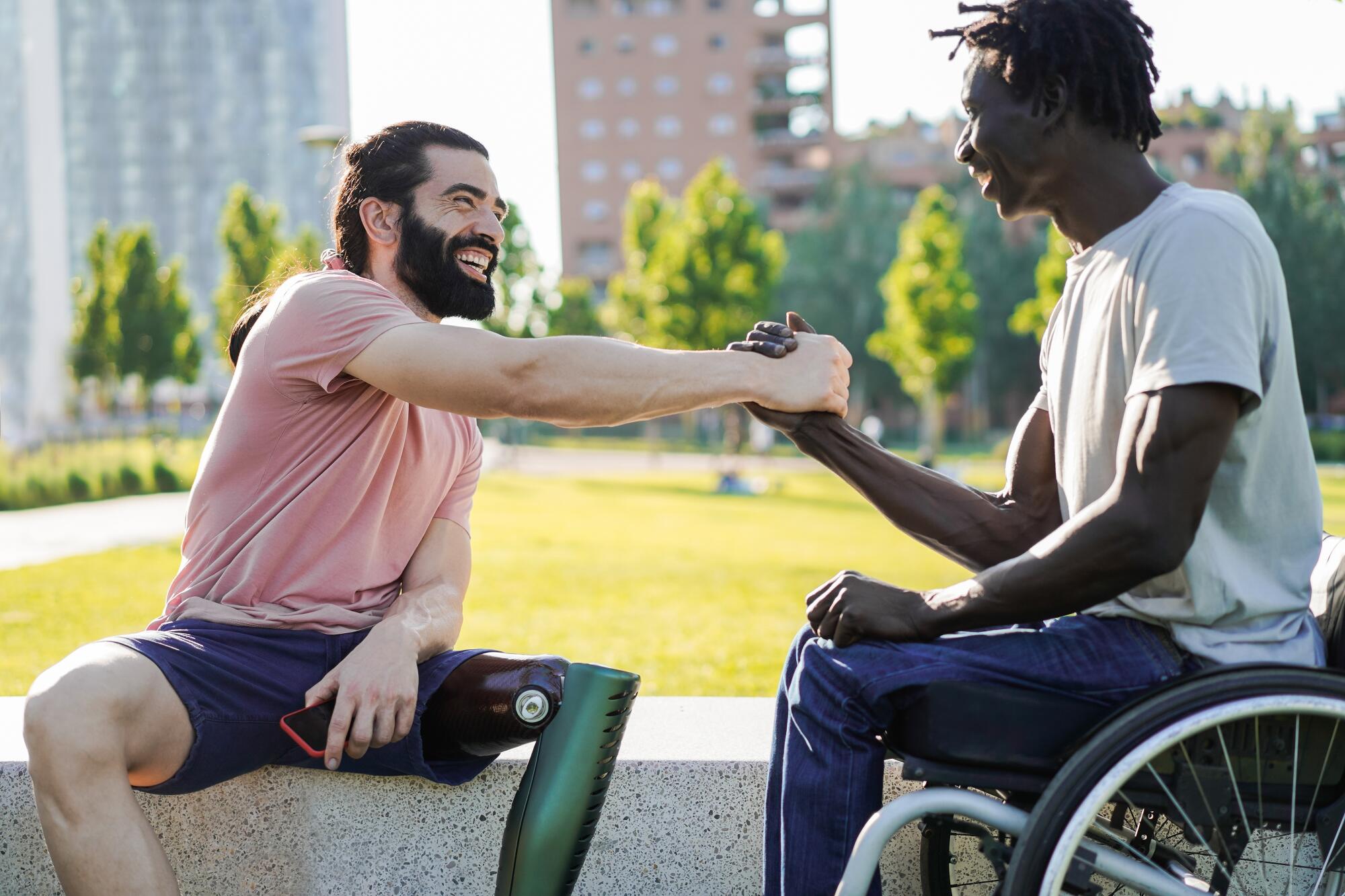 soldiers with above knee amputation shaking hands